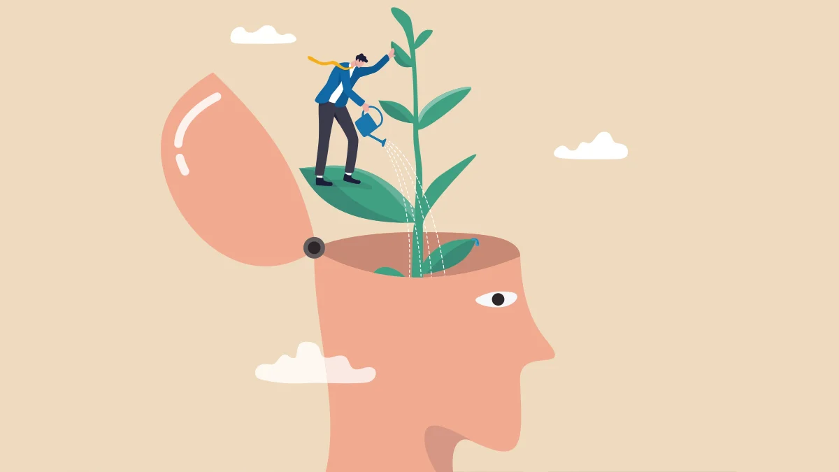 A drawing of an opened head with a plant growing from it and a man watering the plant